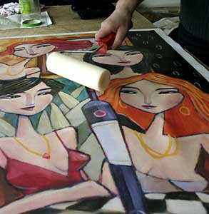 Then a double-coating of UV varnish is rolled on the canvas to protect it from light and liquids.